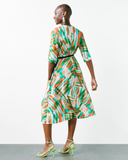 Model wears Tropical Fern Wrap Dress