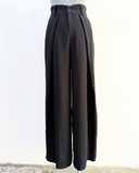Black wide-leg pants on a white background