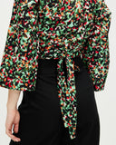 Model wears Wild Meadow Wrap Top
