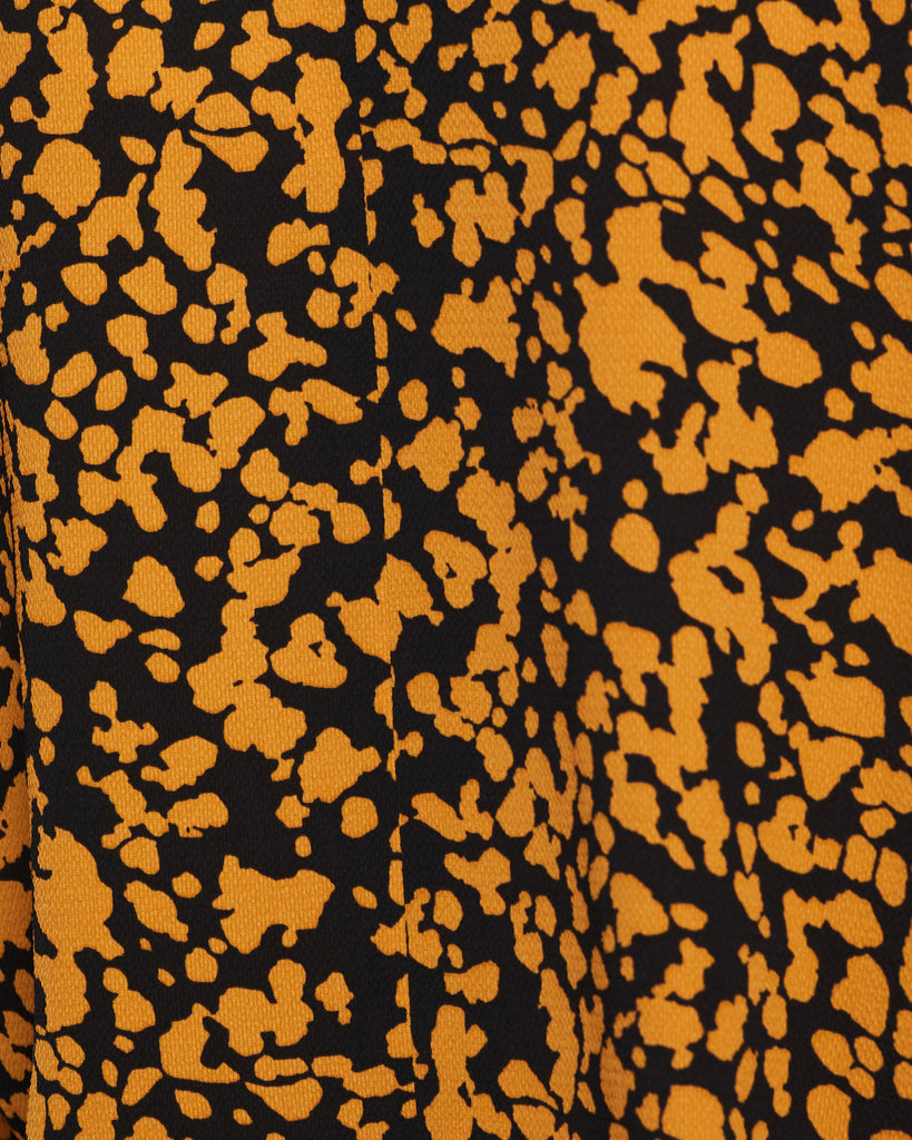Close up of Mustard Fleck Dolman Fabric