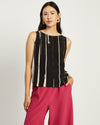 Model wears Black and cream Shell Top