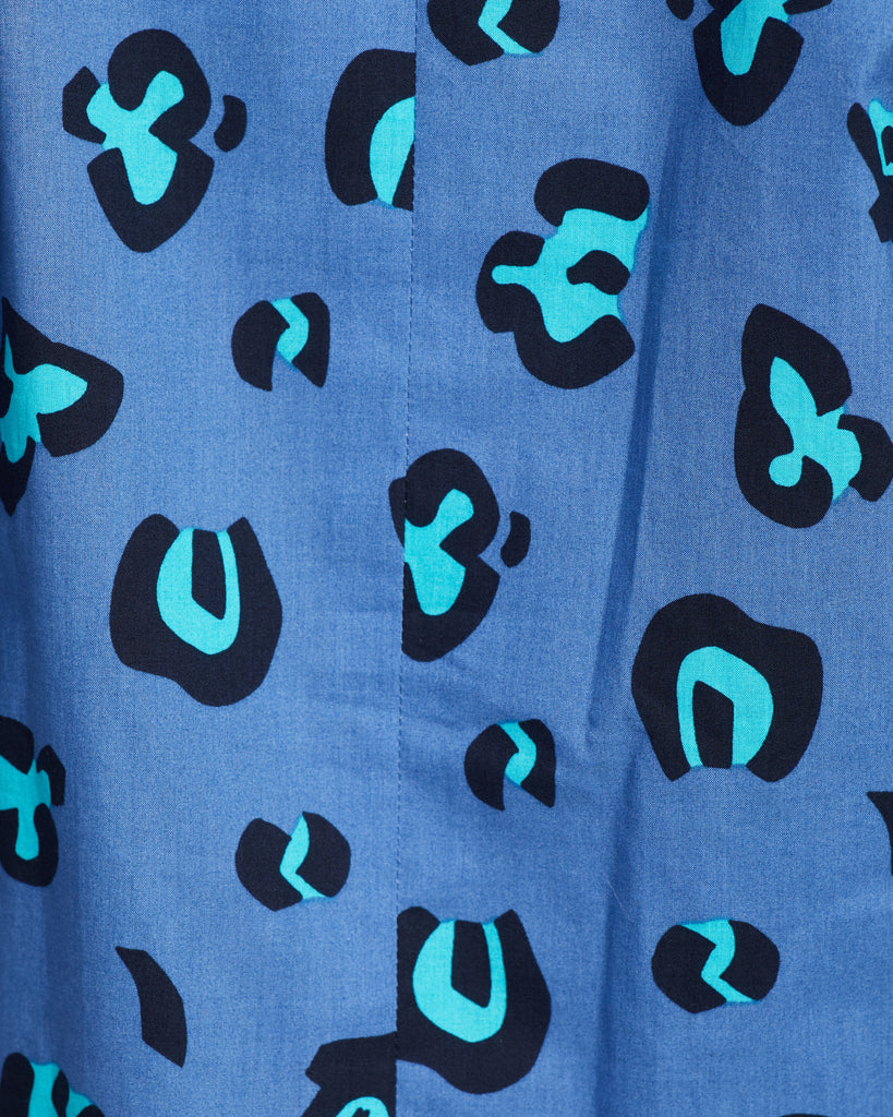 Close up of Fabric with purple with black and teal cheetah pattern