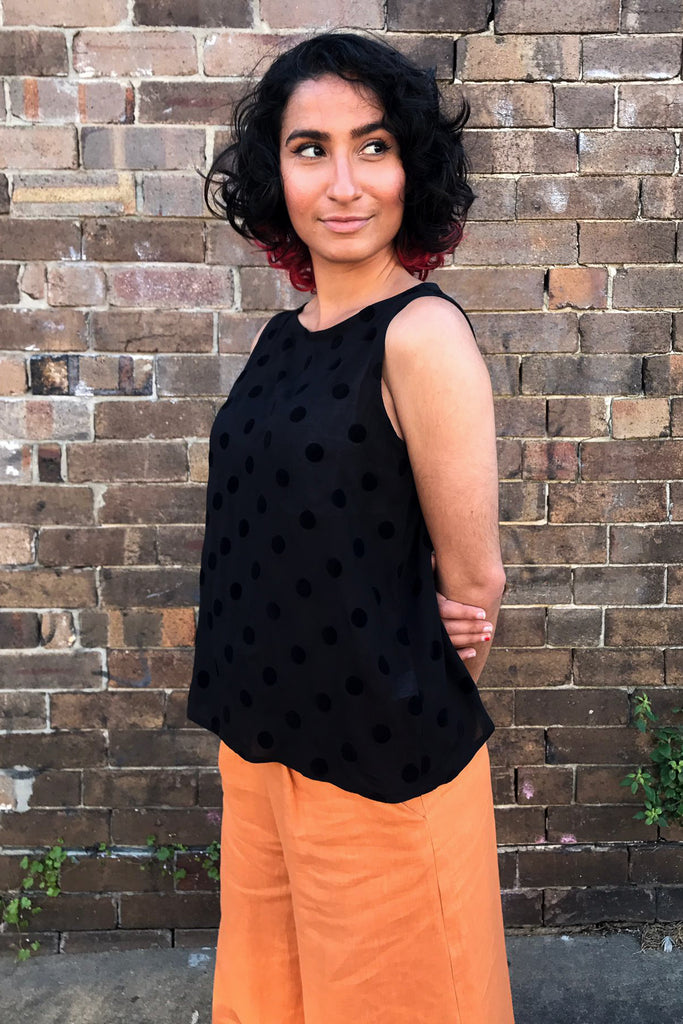 Mariam wears our dusky polka shell top with our apricot linen palazzo pants