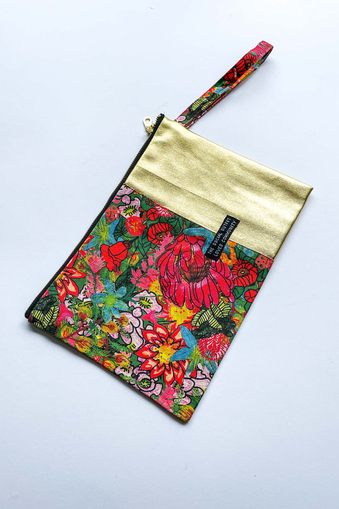 colourful fairfield bloom spliced clutch purse on white background