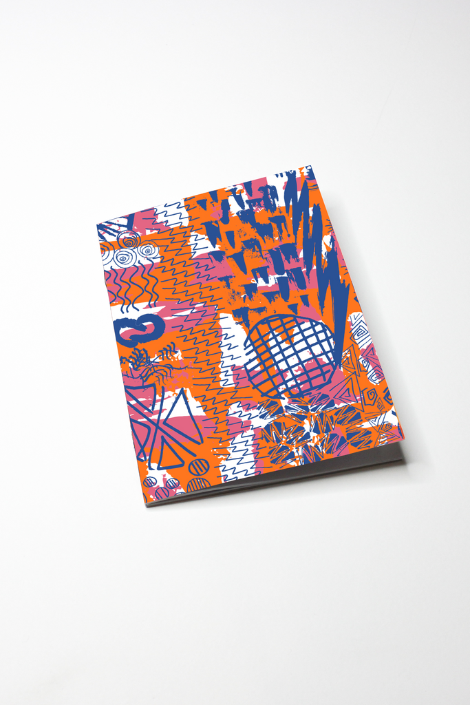 multicoloured notebook featuring our nexus print against a white backdrop