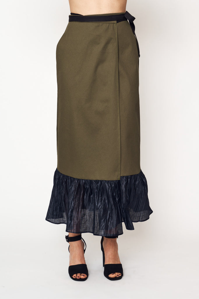 mia wears our olive ruffle wrap skirt with our spring ode dolman top for aw21 earth to sky