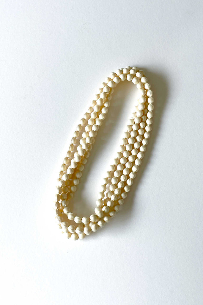 pearl silk long strand necklace by tabitha cambodia against white backdrop