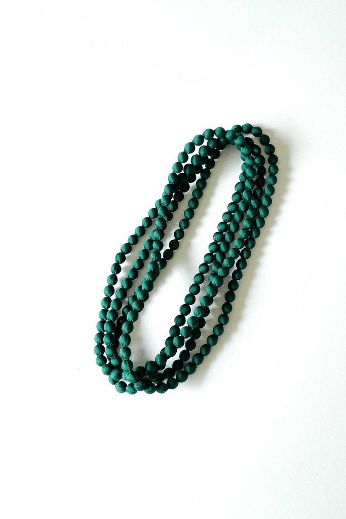 seaweed green silk long strand necklace by tabitha cambodia against white backdrop