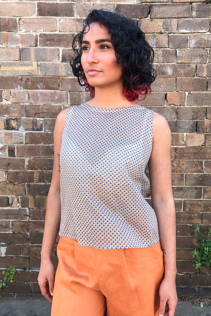 Mariam wears our Tropical Spot Shell Top with our Apricot Linen Palazzo Pants